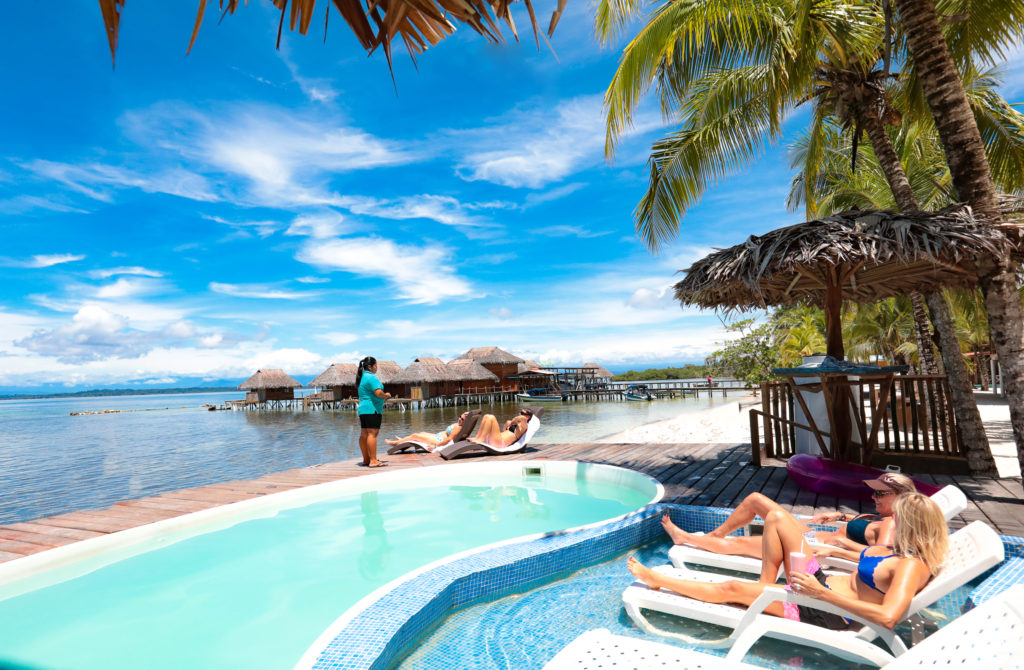 A view of an outdoor pool from the inside.