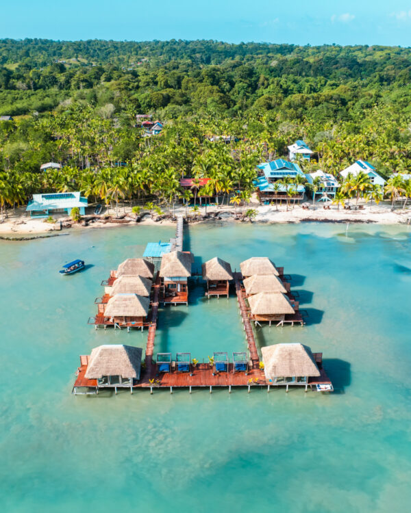 A resort with many huts on the water